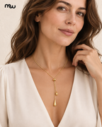 Female model wearing the Cascade Teardrop Lariat Necklace