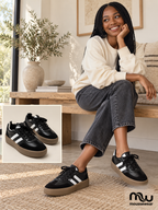 Female model wearing Back in Time Retro Trainers, with shoe close-up and Moussewear logo