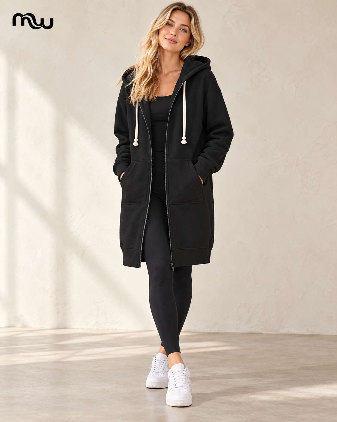 Female model wearing the Runaway Longline Zip Hoodie