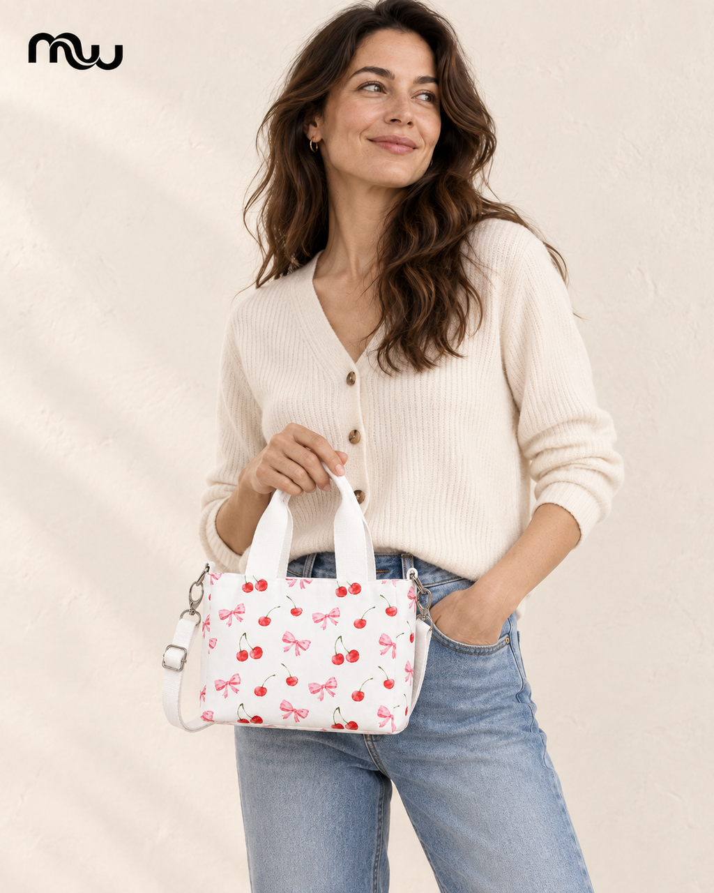 Female model showcasing the Cherry Bomb Bow Mini Tote with Moussewear logo