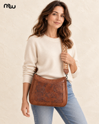 Female model showcasing the Arabesque Embossed Shoulder Bag with Moussewear logo