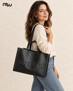 Female model showcasing the Love Letter Embossed Tote with Moussewear logo