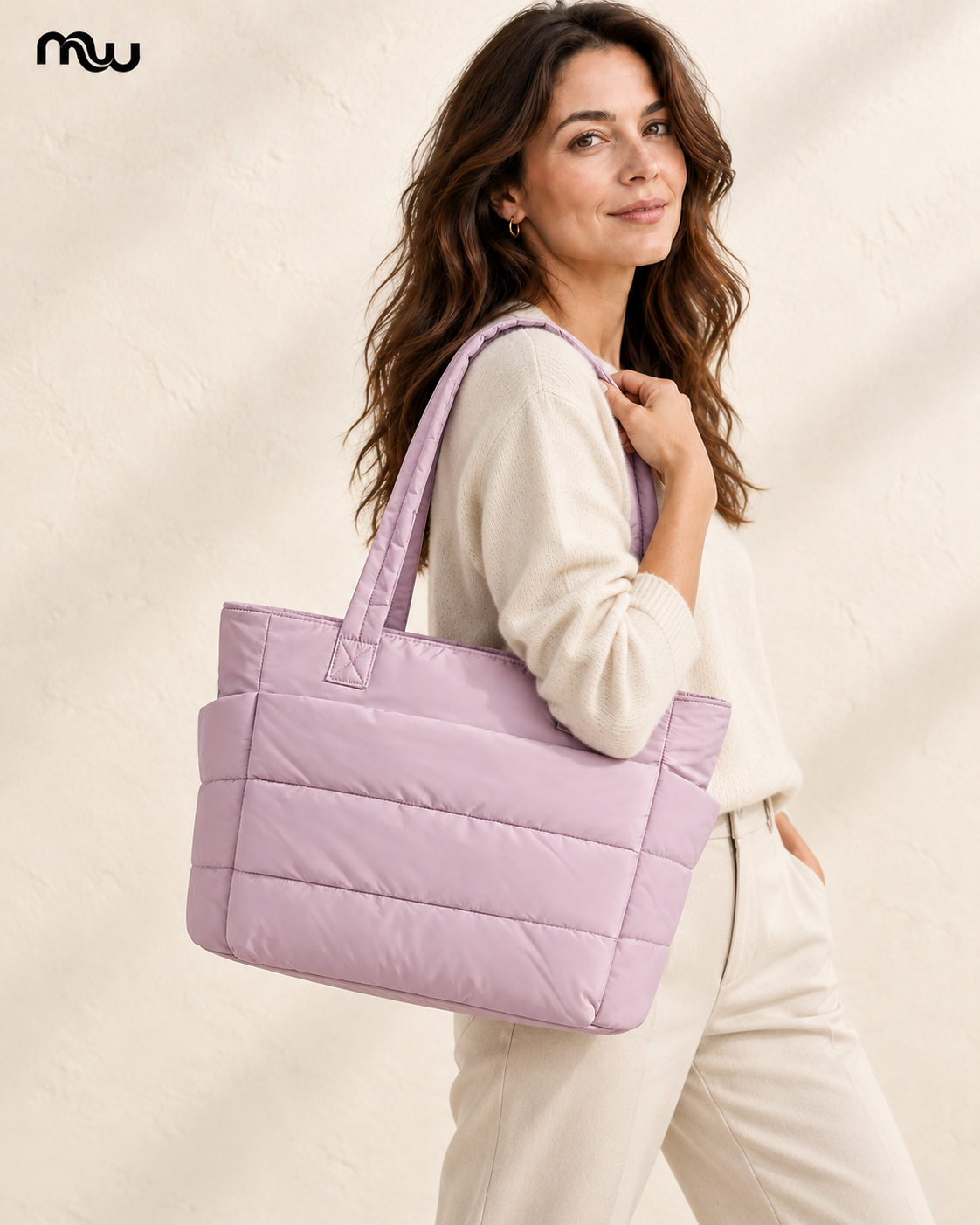Female model showcasing the Metro Quilted Tote with Moussewear logo