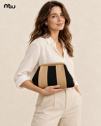 Female model showcasing the Showtime Striped Frame Clutch with Moussewear logo