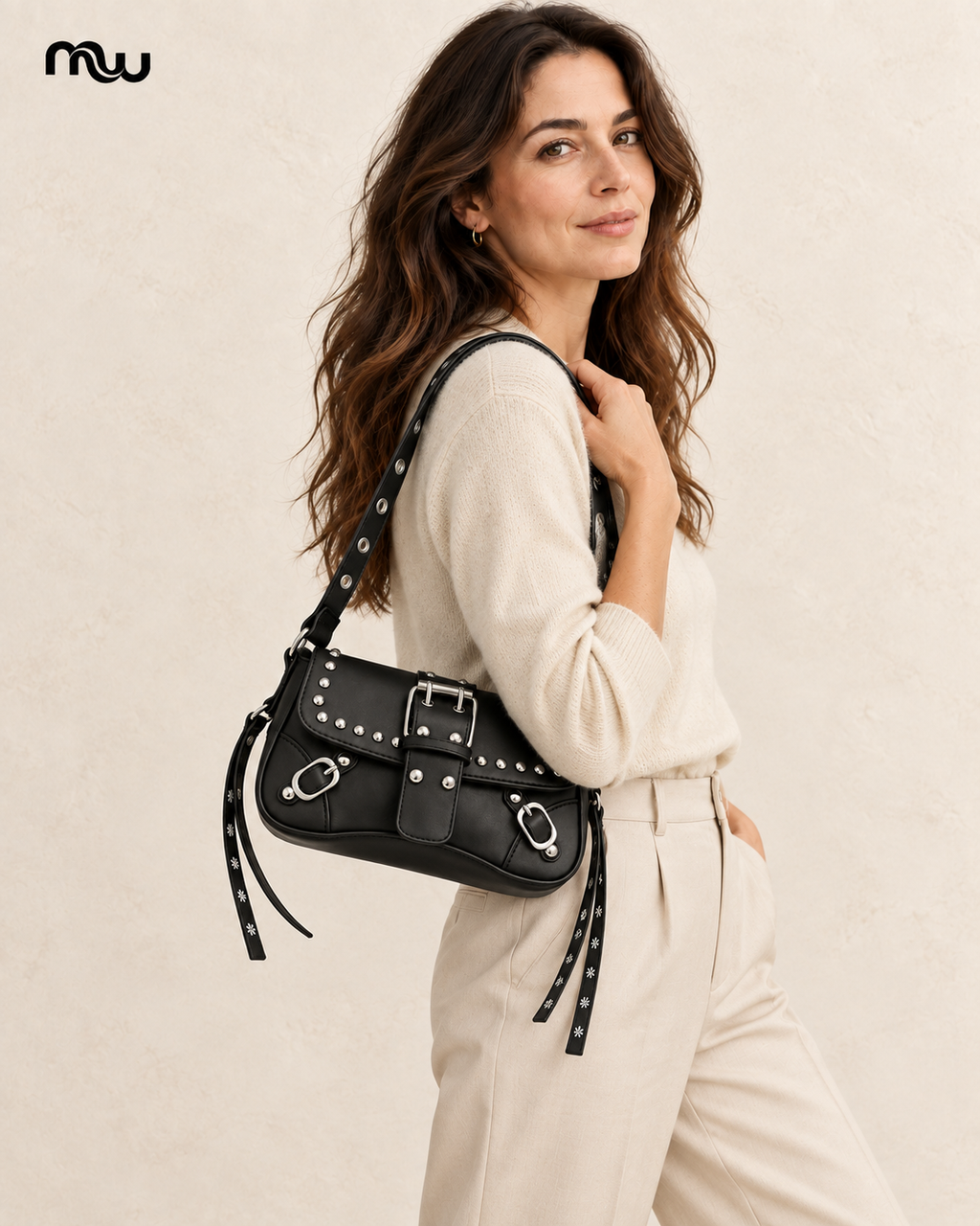 Female model showcasing the Riot Studded Shoulder Bag with Moussewear logo